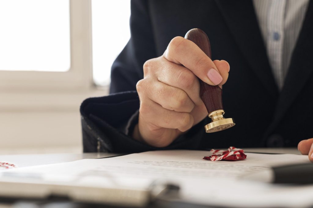 person-using-wax-seal-certificate